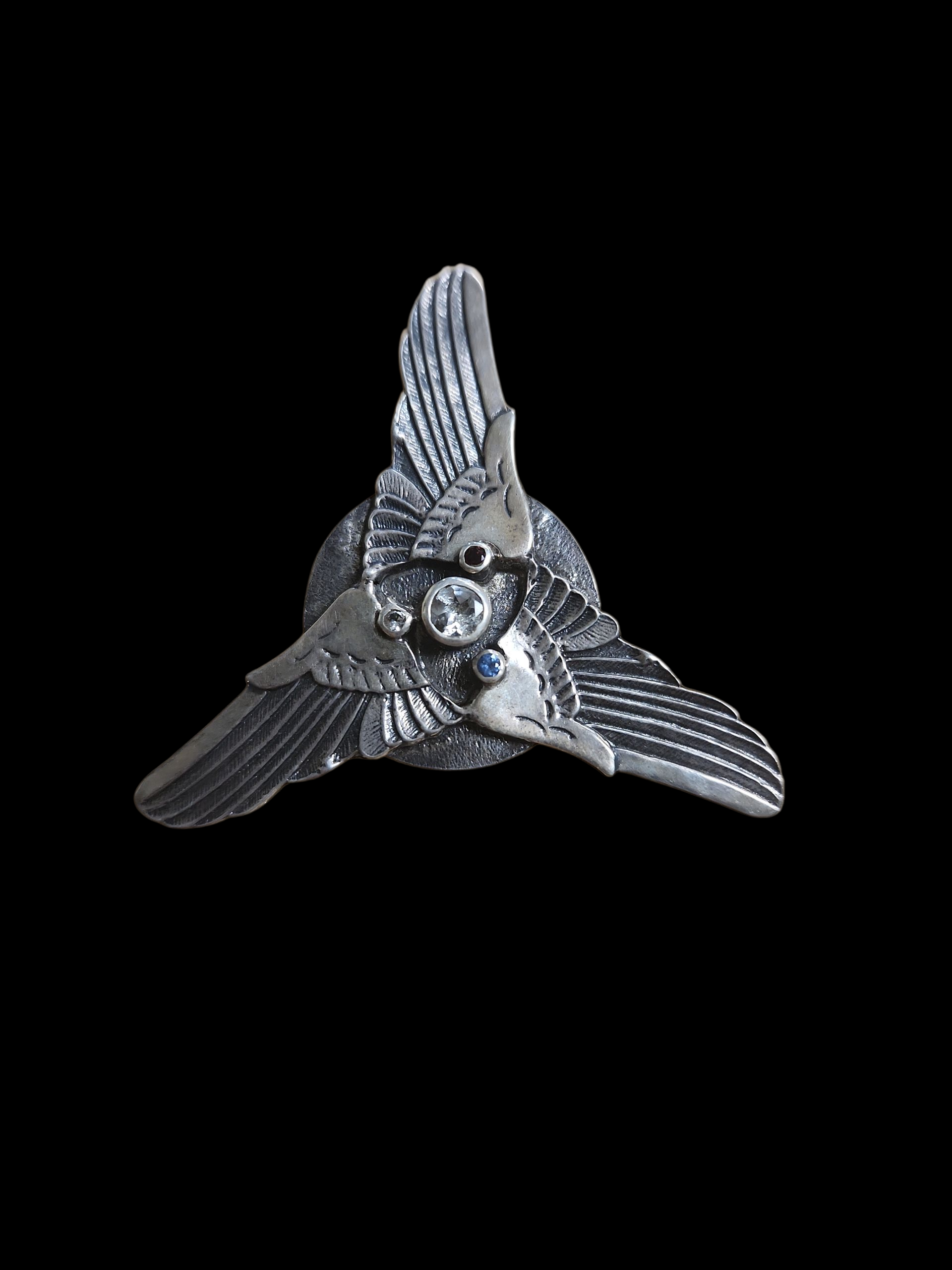 Silver triple wing pendant w/ topaz and garnet