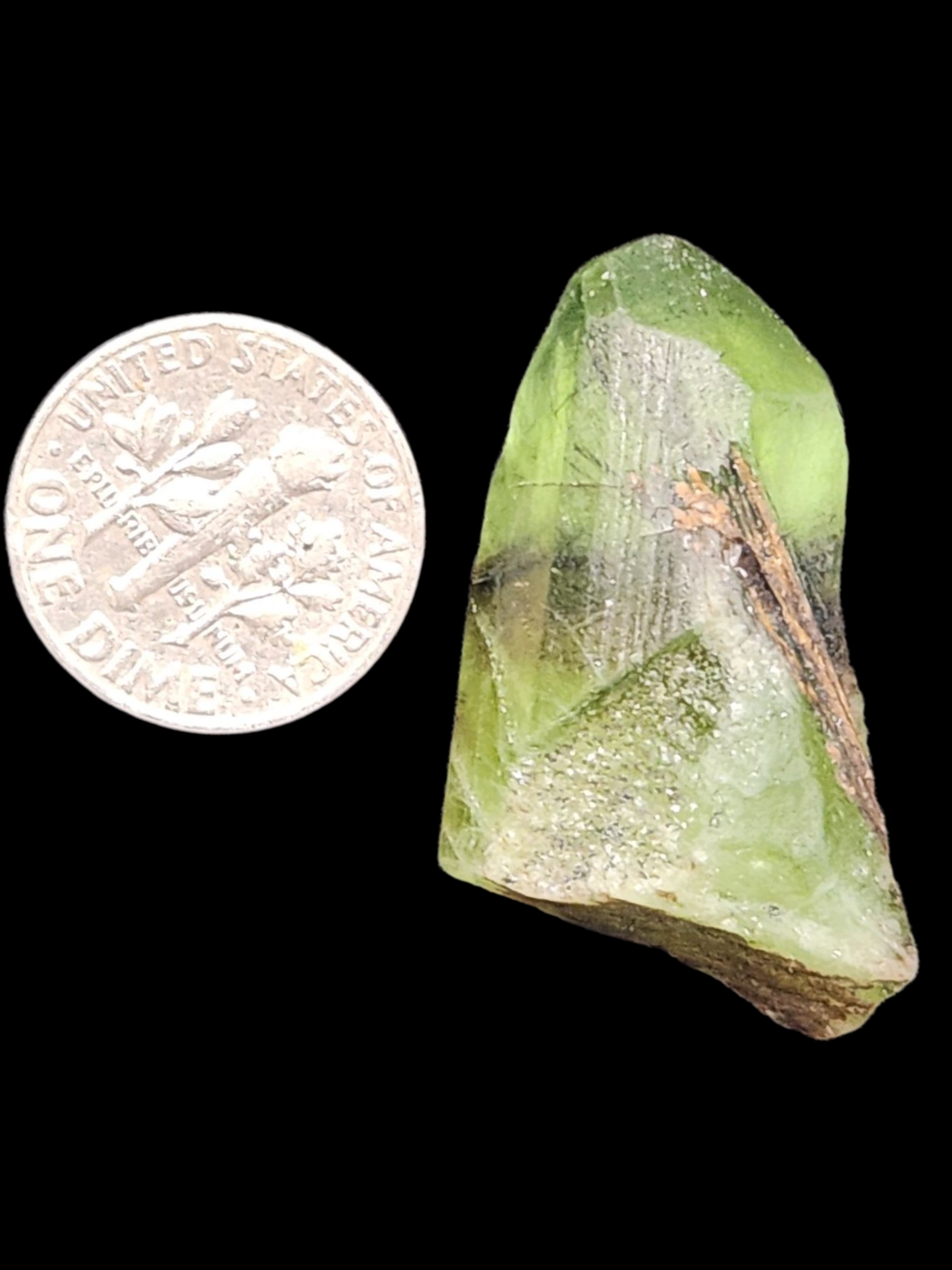 Peridot w/ ludwigite inclusion
