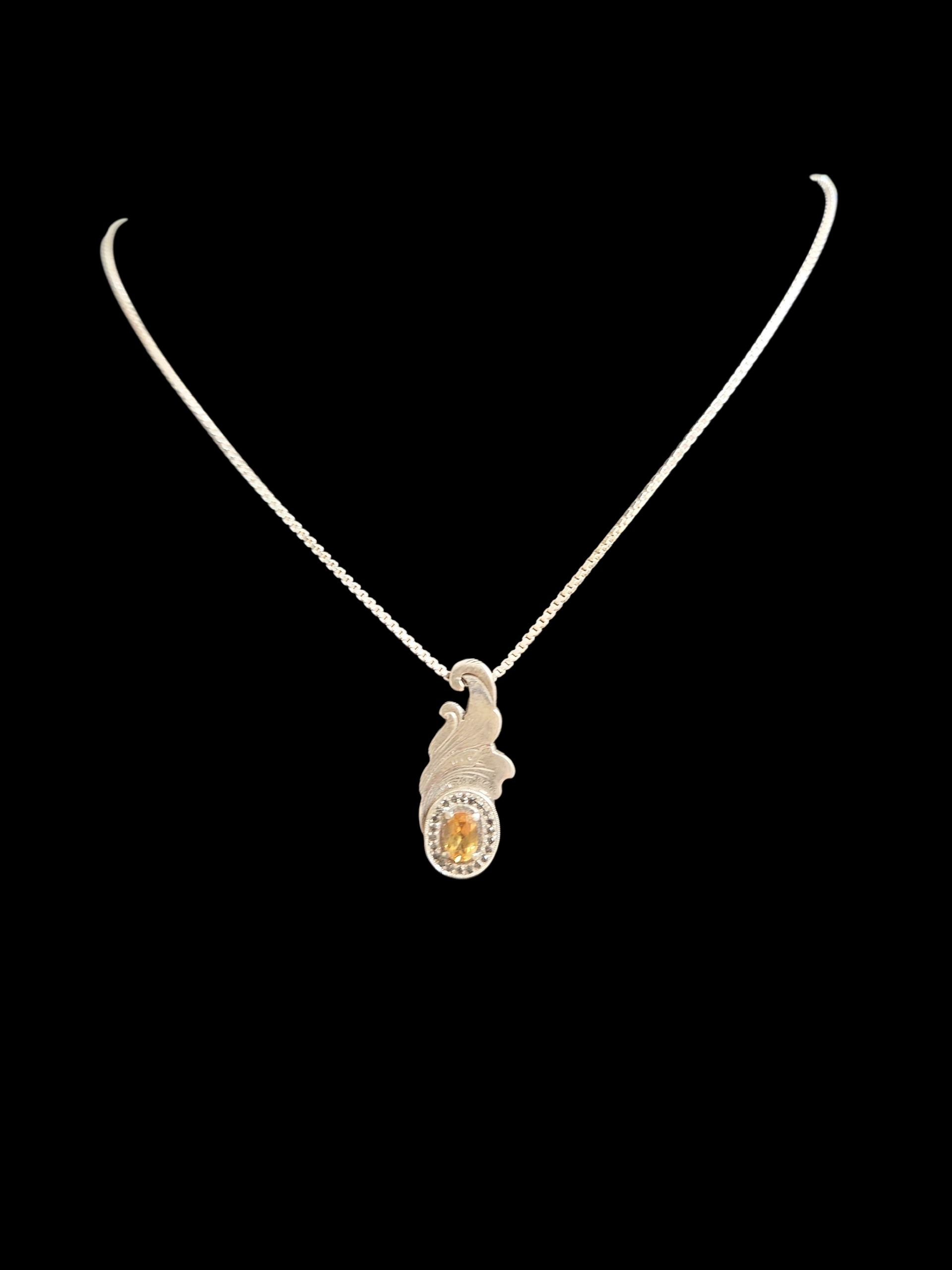Silver ornamental style pendant w/ topaz and black diamonds and 18in silver box chain